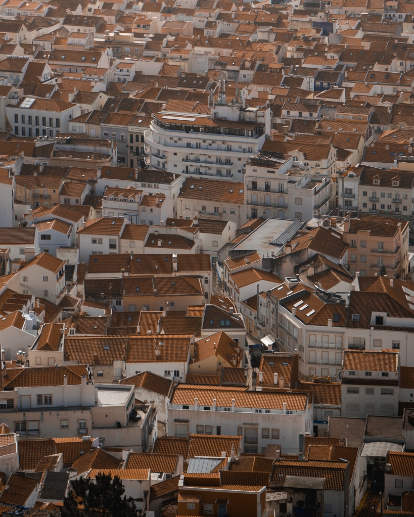 Bird view of the orange tiled roofs of Nazaré, Portugal.